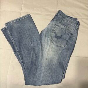 Wrangler Blue Boot Cut Jeans with Classic Distressed Look
